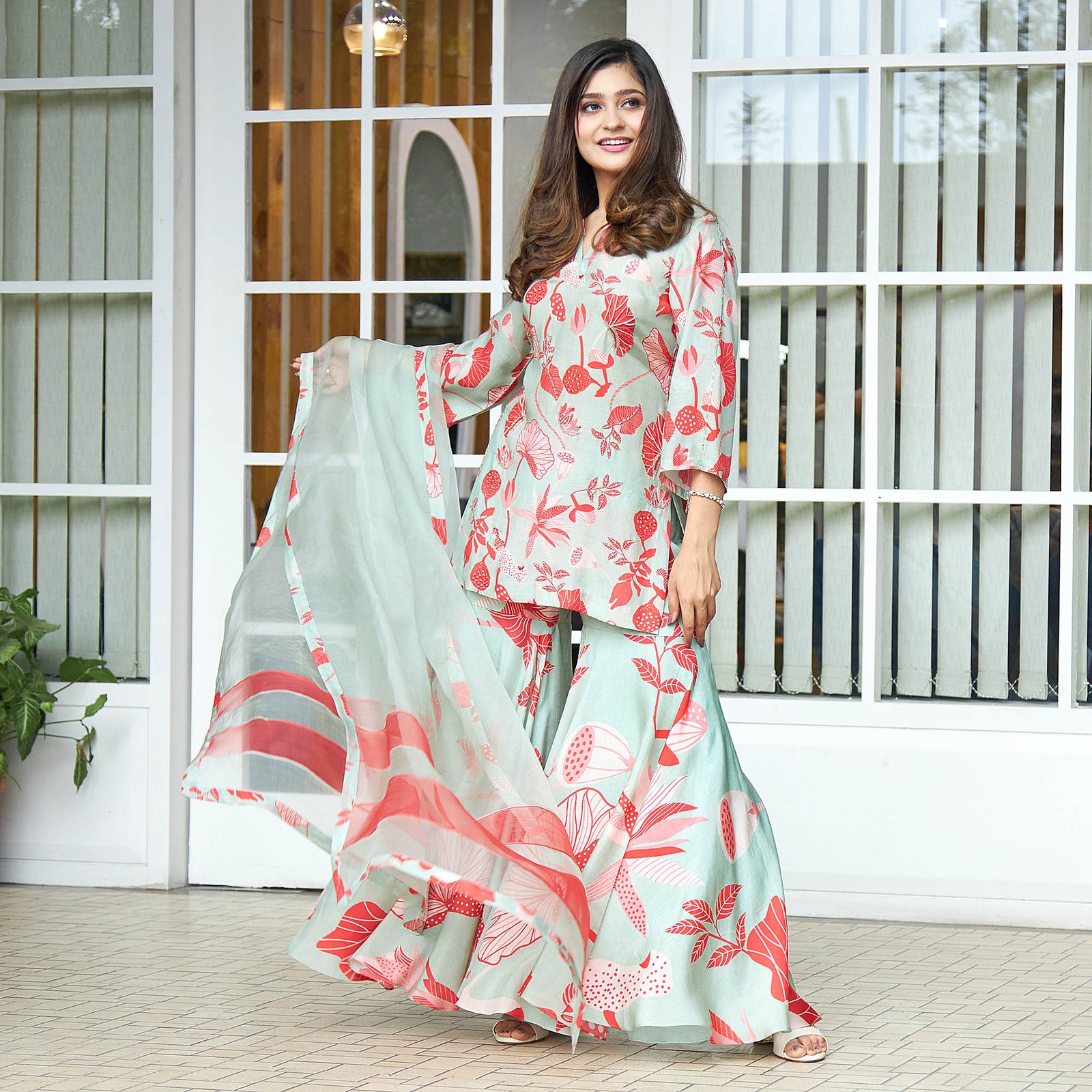 Printed suit with hand embroidered highlight & flared gharara & organza dupatta - Image 4